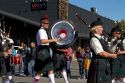 The Boise Highlanders playing bagpipes and drums in the Trailing of the Sheep Parade on Main Street in Ketchum, Idaho, USA.