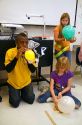 Students blowing up balloons as part of a science experiment in a fourh grade classroom at a public elementary school in Brandon, Florida, USA.