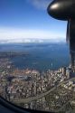 View from an airplane window of Elliott Bay and Seattle, Washington, USA.