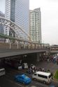 BTS Skytrain station and modern office buildings in Bangkok, Thailand.