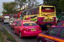 Bus and automobile traffic near the Grand Palace in Bangkok, Thailand.