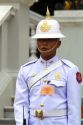 Guard wearing a white uniform at The Grand Palace in Bangkok, Thailand.