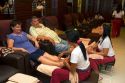 Tourists receive a Thai foot massage in Bangkok, Thailand.