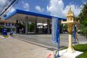 Spirit house placed in front of a gas station on the island of Ko Samui, Thailand.