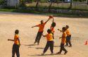 Students play basketball at a Thai elementary school playground on the island of Ko Samui, Thailand.