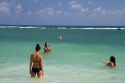 Women play volleyball in the Gulf of Thailand at Chaweng beach on the island of Ko Samui, Thailand.