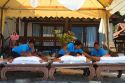 People receive Thai massages at Chaweng beach on the island of Ko Samui, Thailand.