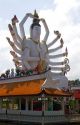 18 arm Buddha statue at Wat Plai Laem temple located on the island of Ko Samui, Thailand.
