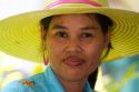 Portrait of a Thai woman wearing a hat at Chaweng beach on the island of Ko Samui, Thailand.