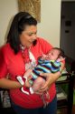 Hispanic mother holding her infant son in Boise, Idaho, USA. MR