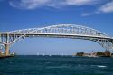 The Blue Water Bridge spanning the St. Clair River connects Port Huron, Michigan with Sarnia, Ontario, Canada.