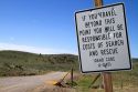 Road sign warning of search and rescue costs for traveling on unimproved road in Owyhee County, Idaho, USA.