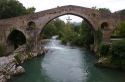 Arched Roman Bridge spanning the Sella River in the municipality of Cangas de Onis in Asturias, Spain.