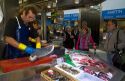 Seafood vendor at the Mercado de al Ribera along the Nervion River at Bilbao, Biscay, Spain.