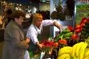 Produce vendor at the Mercado de al Ribera along the Nervion River at Bilbao, Biscay, Spain.