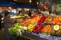 Produce vendor at the Mercado de al Ribera along the Nervion River at Bilbao, Biscay, Spain.