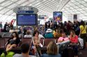 Travelers in a waiting room at Charles de Gaulle Airport, Paris, France.