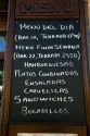 Menu board for a restaurant at Puente La Reina a Basque town along the Way of St. James pilgrimage route, Navarra, Spain.