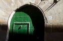 Arched door at Puente La Reina a Basque town along the Way of St. James pilgrimage route, Navarra, Spain.