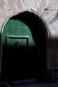 Arched door at Puente La Reina a Basque town along the Way of St. James pilgrimage route, Navarra, Spain.