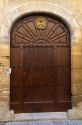 Arched door at Puente La Reina a Basque town along the Way of St. James pilgrimage route, Navarra, Spain.