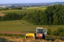 Tractor baling hay west of Angouleme in southwestern France.