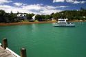 Fishing charter boat on the Bay of Islands at the waterfront town of Russell, North Island, New Zealand.