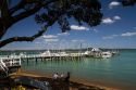 Pier and boats docked in the waterfront town of Russell on the Bay of Islands, North Island, New Zealand.