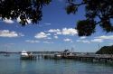 Pier and boats docked in the waterfront town of Russell on the Bay of Islands, North Island, New Zealand.