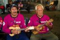 Tahitian men play ukulele at the Auckland Airport, Auckland, North Island, New Zealand.