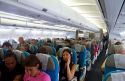 Passengers aboard an Airbus 340 seated in the economy cabin.