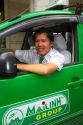 Mai Linh taxi and driver in Ho Chi Minh City, Vietnam.