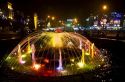 Water fountain lit with colored lights at night in Da Lat, Vietnam.