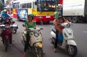 Vietnamese people riding motor scooters in Nha Trang, Vietnam,