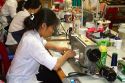 Workers using sewing machines at a clothing factory in Hanoi, Vietnam.