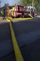 Water supply hose from a pumper fire truck at the scene of a residential fire in Boise, Idaho, USA.
