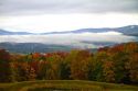 Fall foliage on a misty moring near Stowe, Vermont, USA.