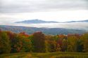 Fall foliage on a misty moring near Stowe, Vermont, USA.