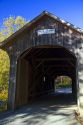 The Mill Covered Bridge crossing the Lamoille River in Belvidere, Vermont, USA.