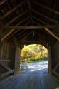 The Mill Covered Bridge crossing the Lamoille River in Belvidere, Vermont, USA.