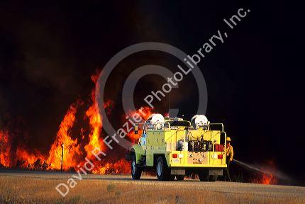 Firefighters battle a brush fire east of Boise, Idaho.