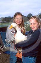Young girls holding a pet duck. MR