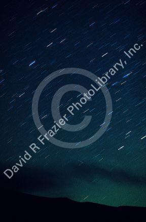 A night sky with star trails in Idaho. Streaks caused by earth rotation during time exposure. Different colors caused by the gases on the stars.