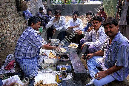 A street vendor making paratha in Delhi, India.