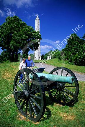 Tourists stand near a cannon at Vicksburg Battle Field in Mississippi.