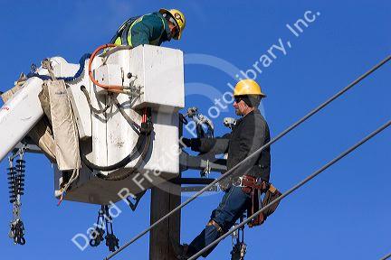 Electric power lineman installing new lines in Boise, Idaho.