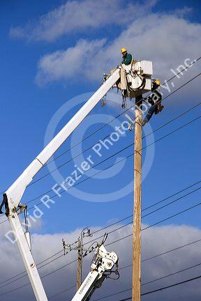 Electric power lineman installing new lines in Boise, Idaho.