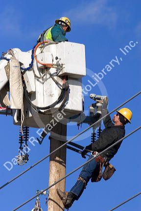 Electric power lineman installing new lines in Boise, Idaho.