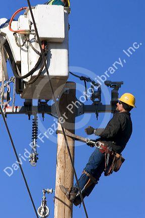 Electric power lineman installing new lines in Boise, Idaho.