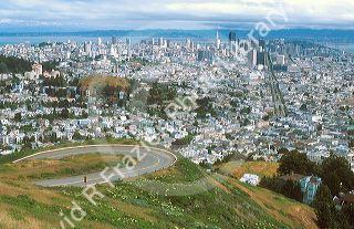 A view from twin peaks down Market Street in San Francisco, California.  Panoramic view of cityscape.